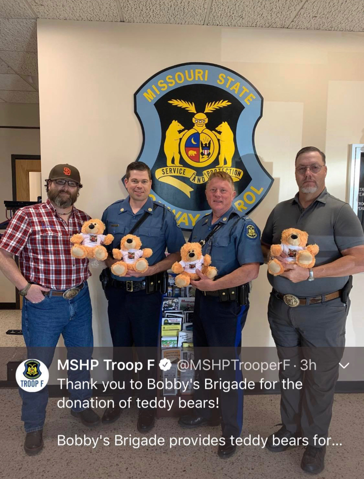 Missouri State Highway Patrol Troop F holding donated teddy bears